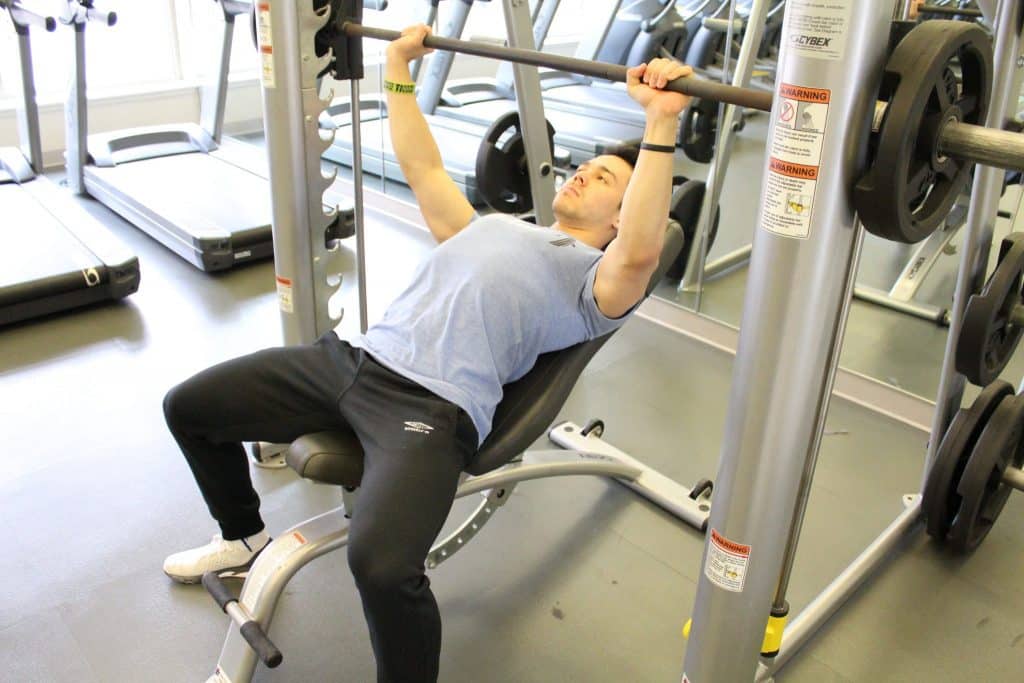 Smith Machine Bench Press Add This Upper Body Exercise To Your Chest Workout Workout Routine Warehouse Smith Machine Bench Press Add This Upper Body Exercise To Your Chest Workout Workout Routine Warehouse